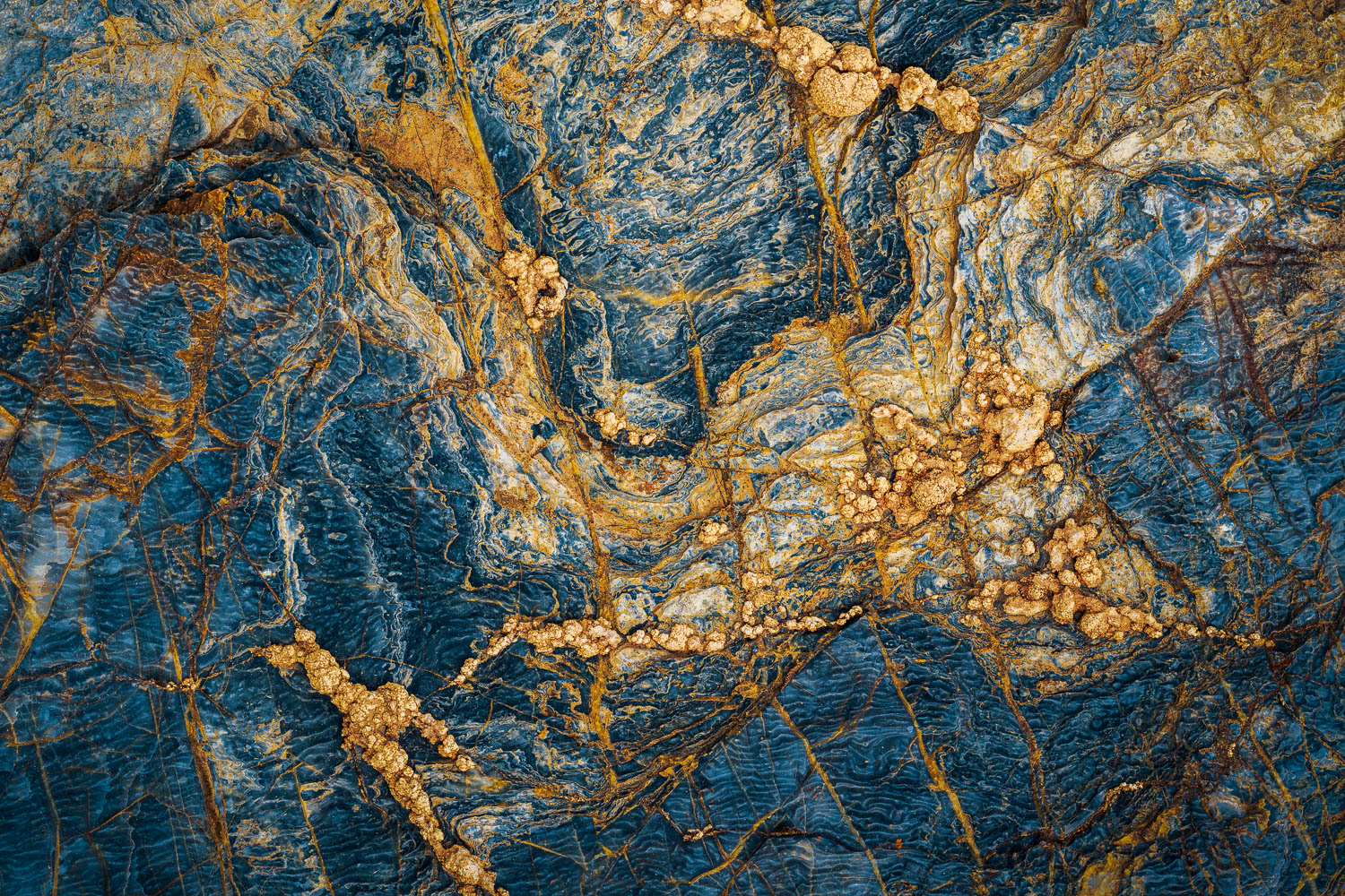 The Mix Up Blue and yellow geological formations in swirling pattern